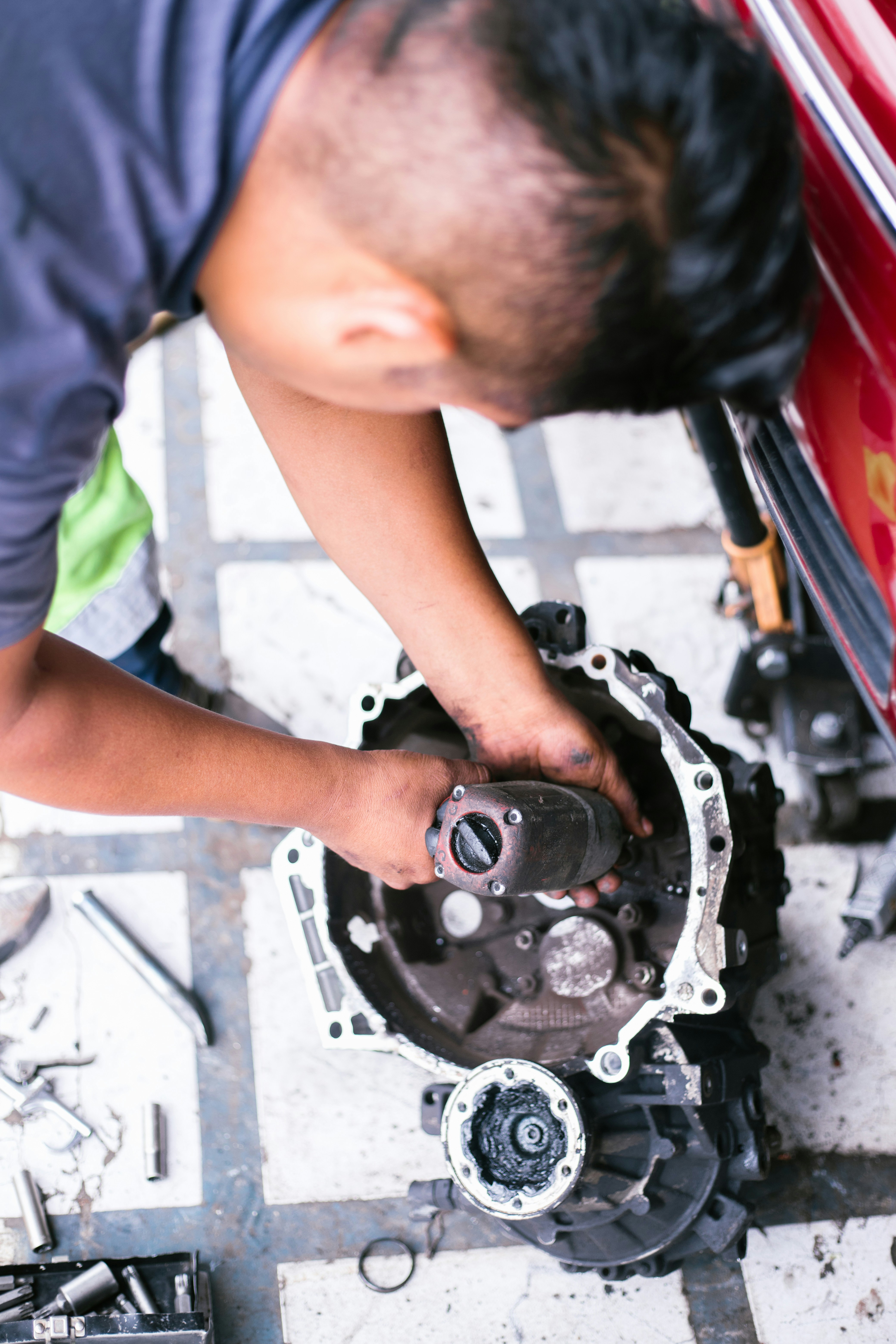 Technician performing a transmission repair in the Navarre Transmission shop